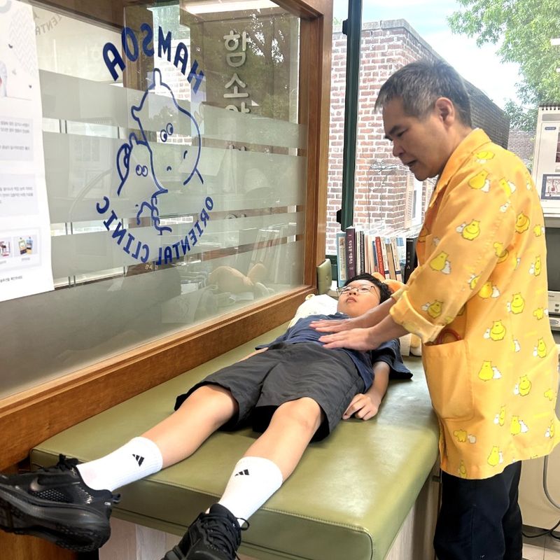 The doctor checking in with a young patient at Hamsoa NY